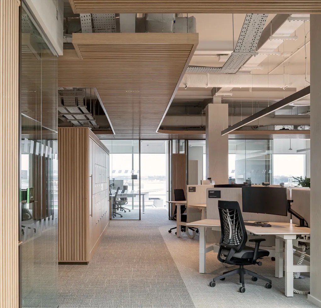 Modern open-plan office with timber finishes and workplace lockers